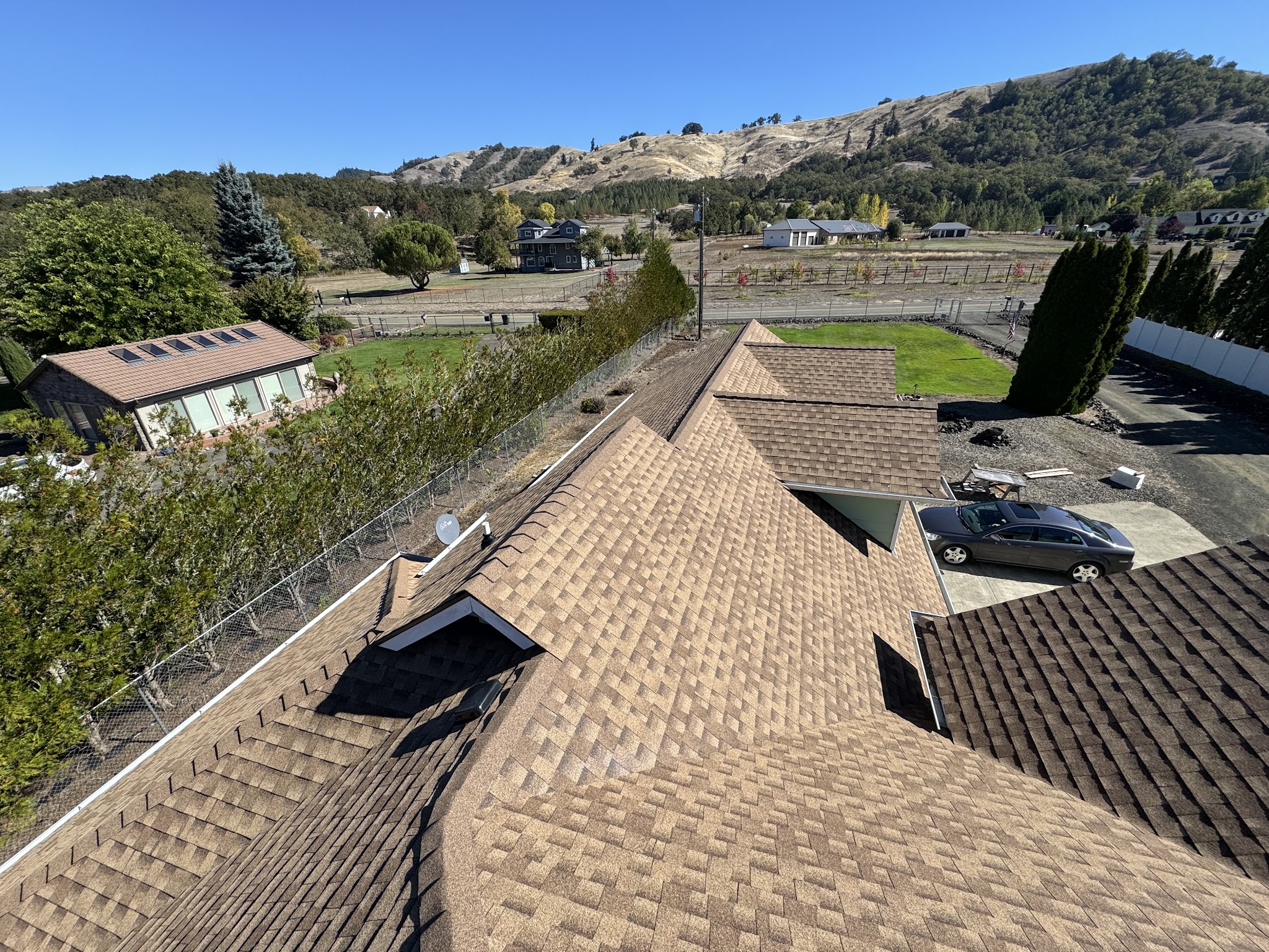 Completed roof replacement on a large home overlooking the Douglas County hills